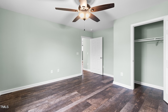 unfurnished bedroom featuring dark hardwood / wood-style flooring, a closet, and ceiling fan