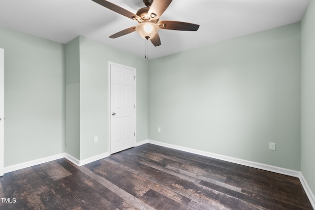 unfurnished room featuring ceiling fan and dark hardwood / wood-style flooring