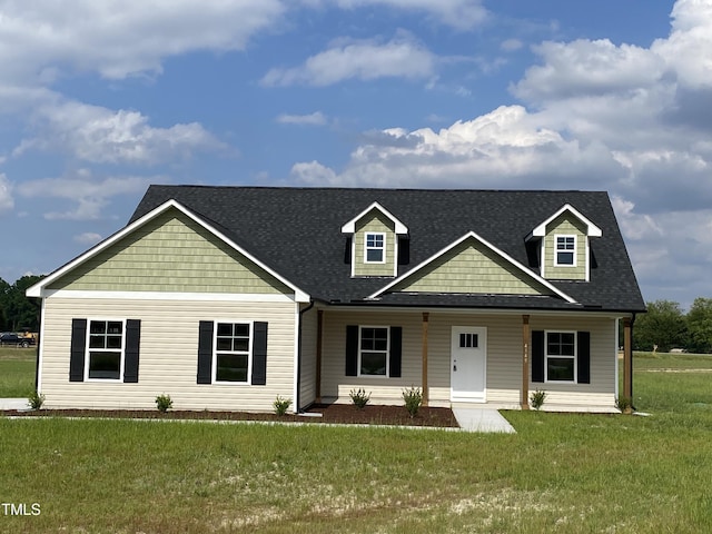 4149 Pope Farm Rd, Stantonsburg, NC 27883 - view of front of home with a front yard, a shingled roof, and covered porch