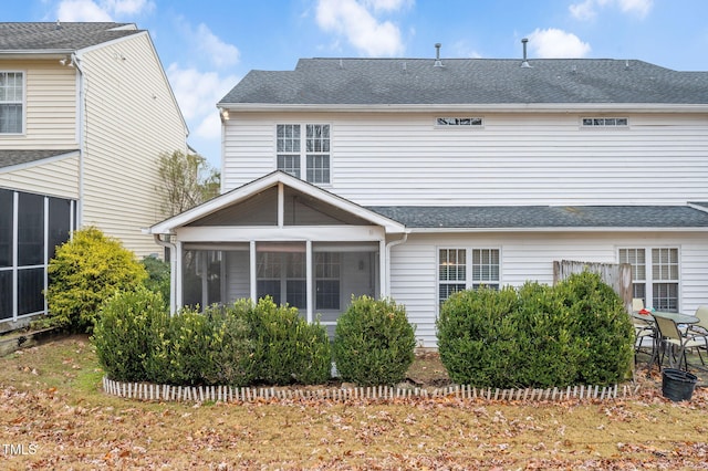 back of property featuring a sunroom