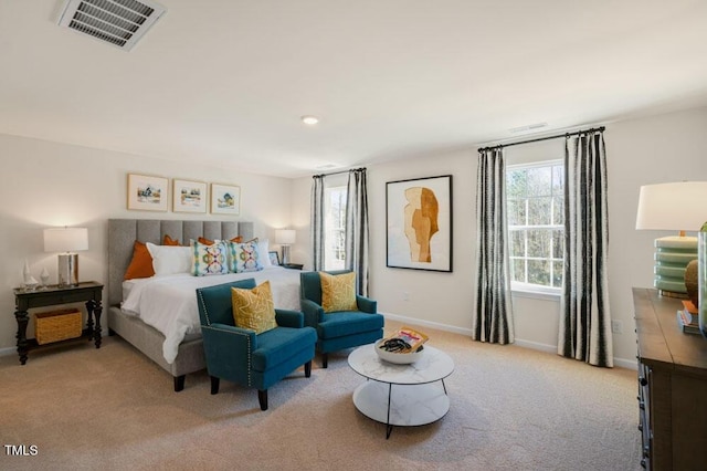 bedroom featuring light colored carpet