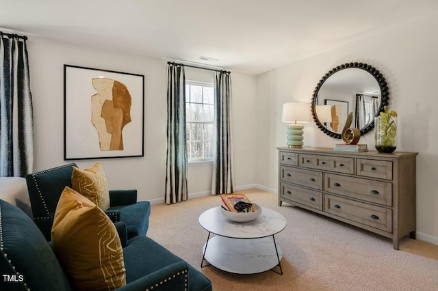 sitting room featuring light carpet