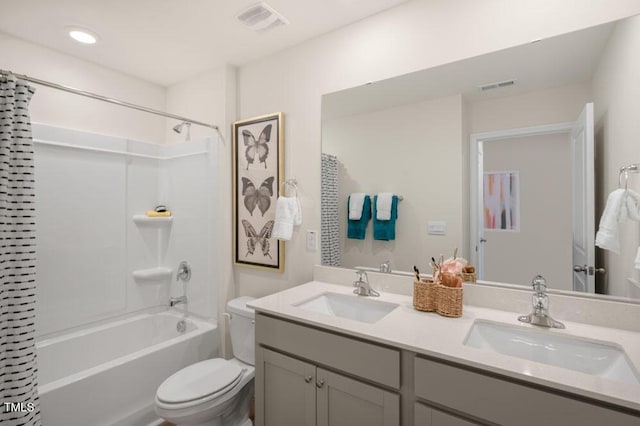 full bathroom with vanity, toilet, and shower / tub combo