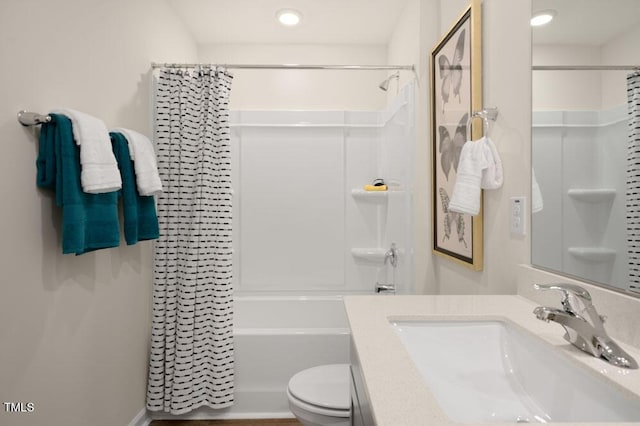 full bathroom featuring shower / bath combination with curtain, vanity, and toilet