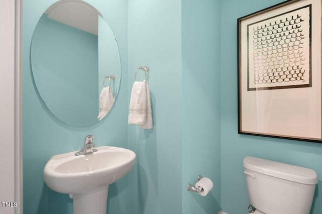 bathroom featuring sink and toilet