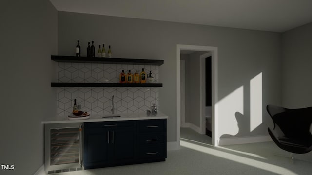 bar with tasteful backsplash and beverage cooler