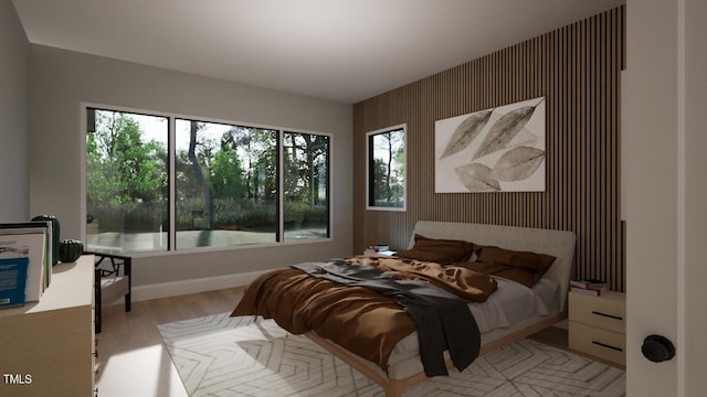 bedroom featuring wood walls and light wood-type flooring