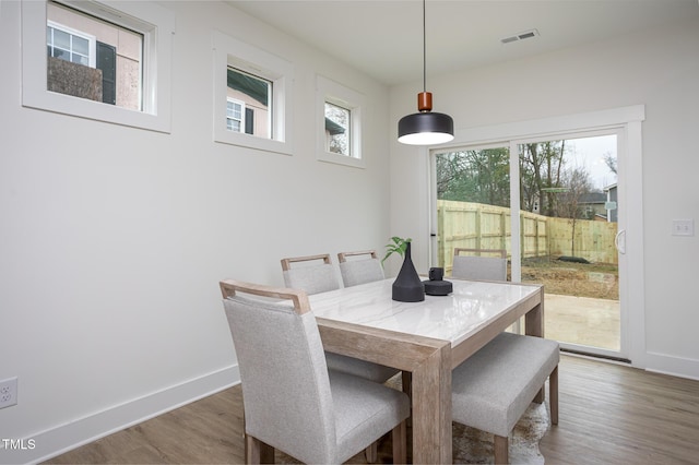 dining room with wood-type flooring