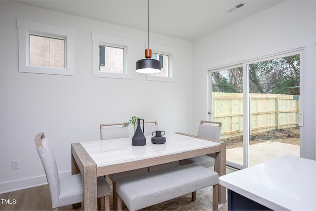 dining area featuring dark hardwood / wood-style floors