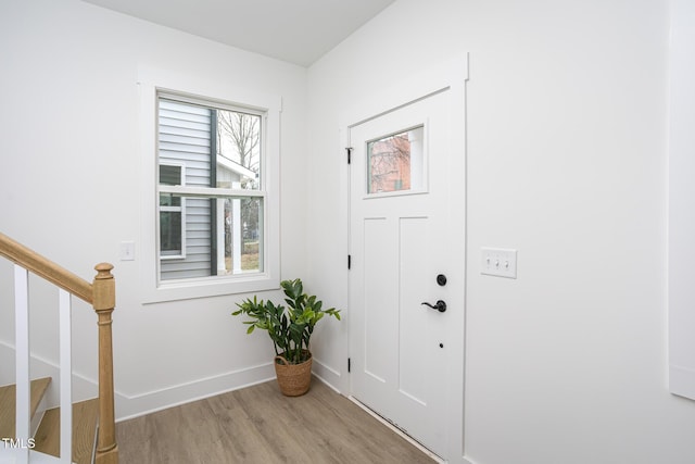 foyer entrance with light hardwood / wood-style floors