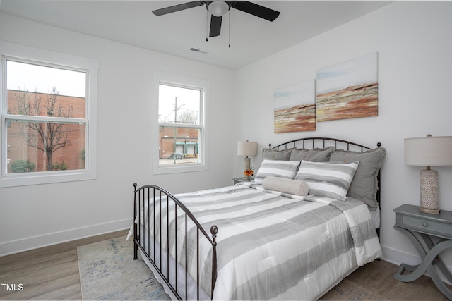 bedroom featuring wood-type flooring and ceiling fan