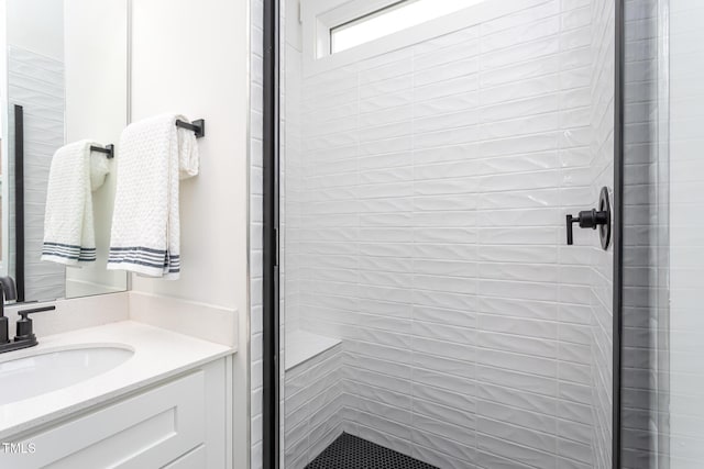 bathroom featuring vanity and an enclosed shower