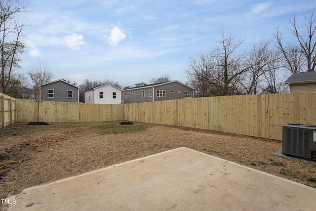 view of yard featuring cooling unit and a patio area