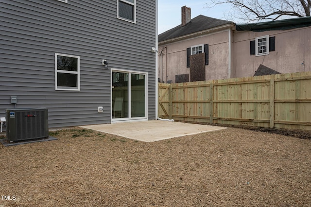 back of property with a patio and central air condition unit