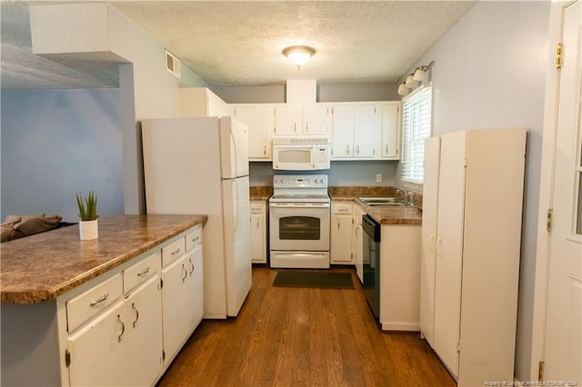 kitchen featuring a textured ceiling, white appliances, sink, dark hardwood / wood-style floors, and white cabinetry