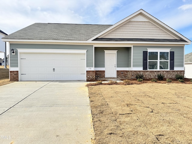 view of front of house featuring a garage and a front yard