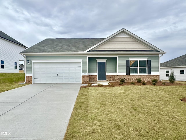 craftsman-style home featuring a front lawn, brick siding, a garage, and driveway