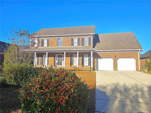 colonial inspired home with a garage