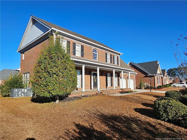 rear view of property featuring a porch