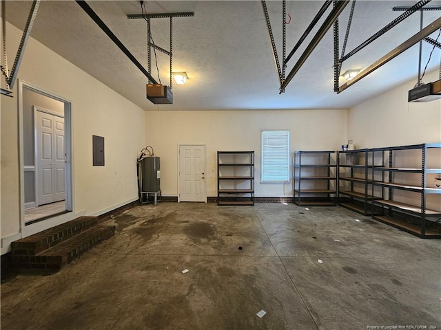 garage featuring electric panel, a garage door opener, and water heater