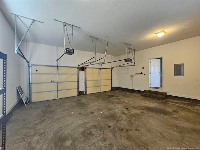 garage with electric panel and a garage door opener