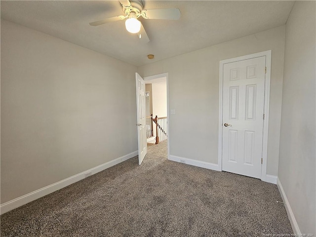 unfurnished bedroom with carpet floors and ceiling fan