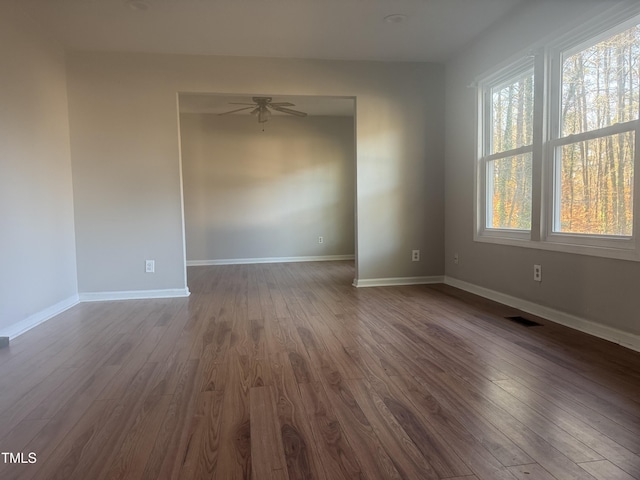 spare room with wood-type flooring and ceiling fan