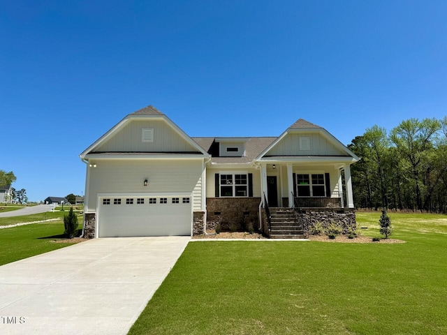 19 Covey Rise Way, Lillington, NC 27546 - craftsman-style house featuring covered porch, a front lawn, concrete driveway, a garage, and stone siding