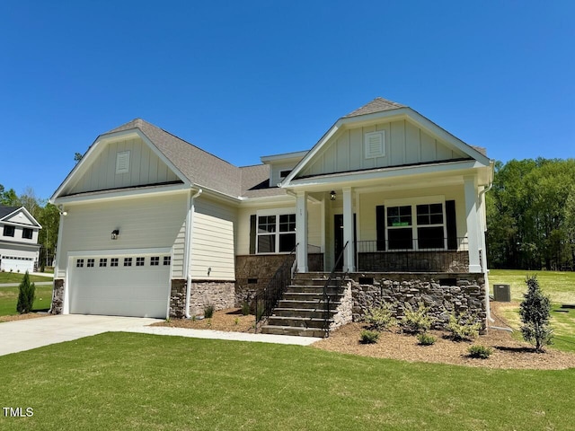 19 Covey Rise Way, Lillington, NC 27546 - craftsman house with board and batten siding, a porch, a front lawn, a garage, and driveway