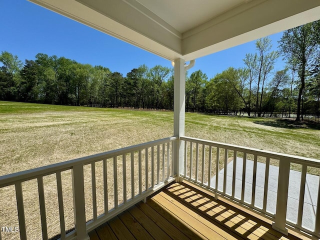19 Covey Rise Way, Lillington, NC 27546 - porch featuring a yard and view of wooded area