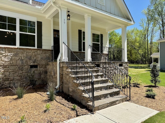 19 Covey Rise Way, Lillington, NC 27546 - view of exterior entry with stone siding, board and batten siding, and covered porch
