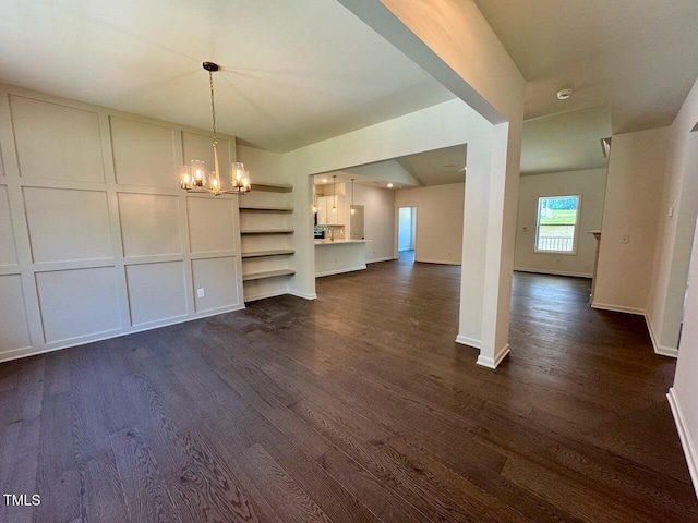19 Covey Rise Way, Lillington, NC 27546 - unfurnished living room featuring a chandelier and dark wood-type flooring