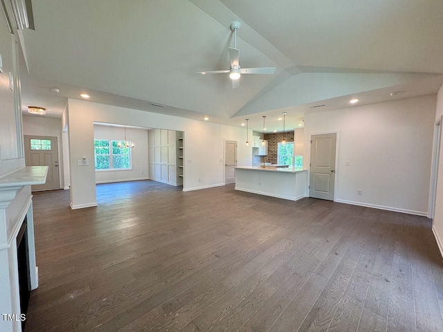 19 Covey Rise Way, Lillington, NC 27546 - unfurnished living room featuring dark wood finished floors, ceiling fan, recessed lighting, a chandelier, and high vaulted ceiling