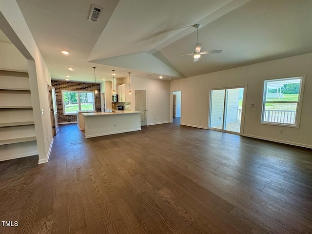 19 Covey Rise Way, Lillington, NC 27546 - unfurnished living room featuring dark wood-style floors, ceiling fan, lofted ceiling, and recessed lighting