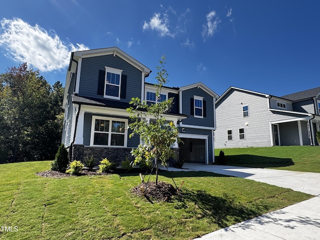 view of property featuring a garage and a front yard