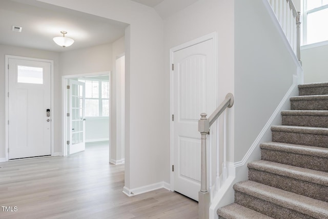 entrance foyer with light hardwood / wood-style flooring