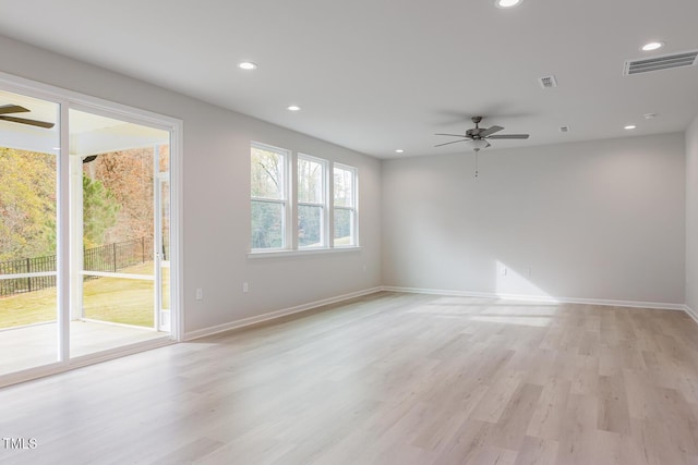 unfurnished room featuring ceiling fan and light wood-type flooring