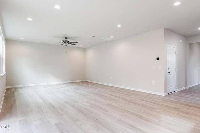 spare room with ceiling fan and light hardwood / wood-style flooring