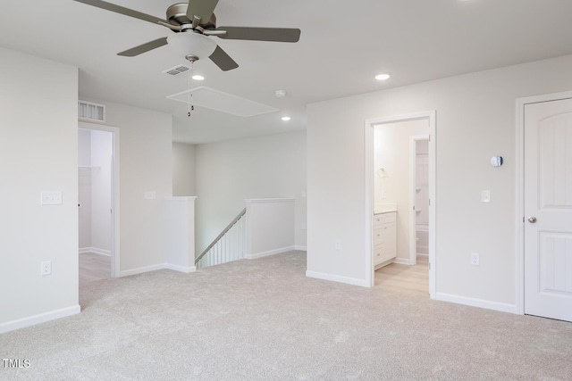 carpeted empty room featuring ceiling fan