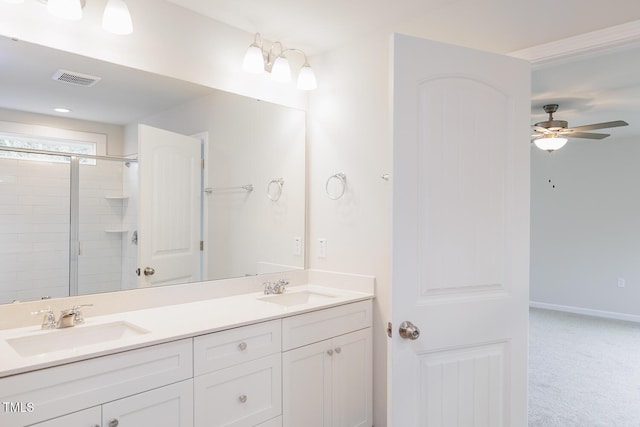 bathroom featuring ceiling fan, vanity, and walk in shower