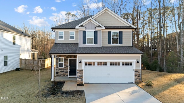 craftsman inspired home with a front lawn and a garage