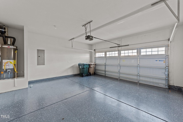 garage featuring electric panel, water heater, and a garage door opener