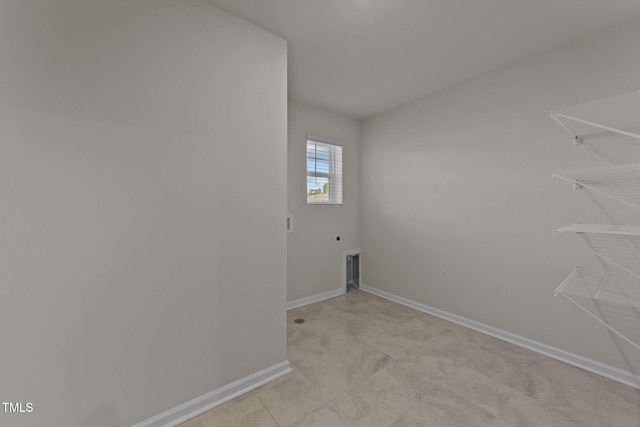 washroom with hookup for an electric dryer