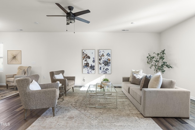 living room featuring ceiling fan and wood-type flooring