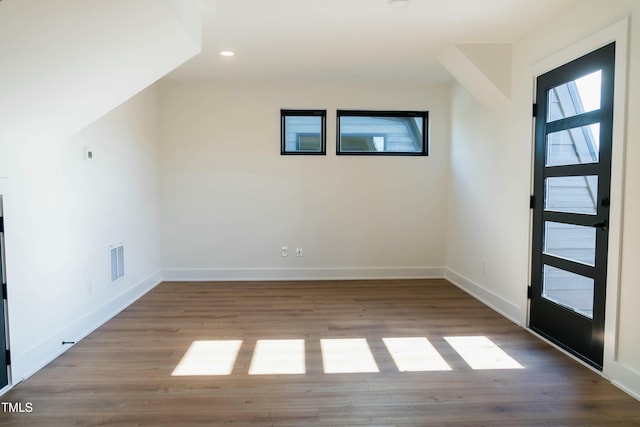 additional living space with light wood-type flooring