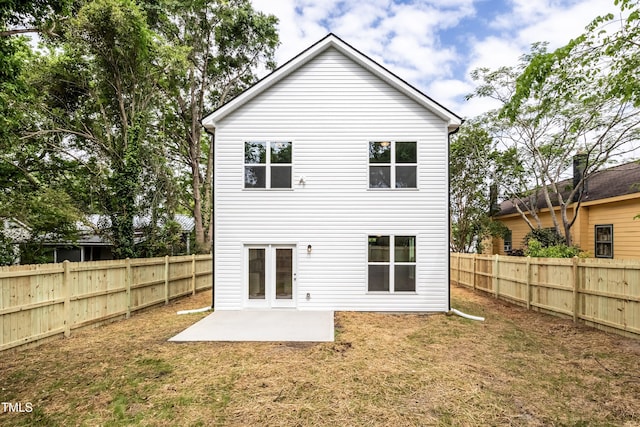 back of house with a patio area