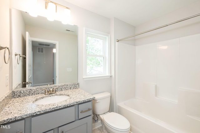 full bathroom with shower / tub combination, vanity, and toilet