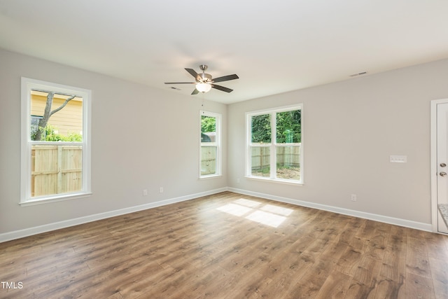 spare room with ceiling fan and hardwood / wood-style flooring