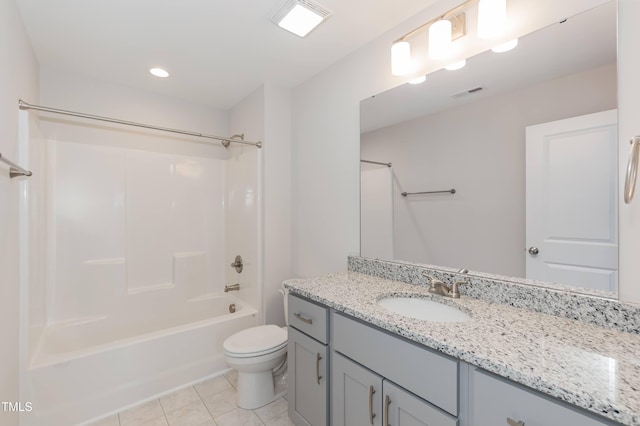 full bathroom featuring tile patterned floors, vanity, toilet, and washtub / shower combination