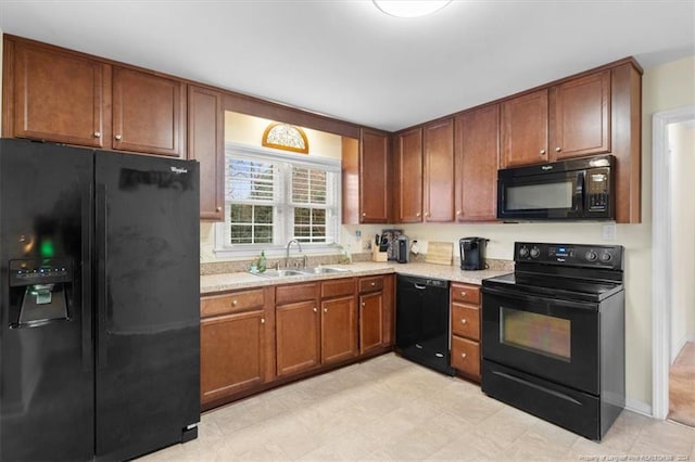 kitchen with sink and black appliances